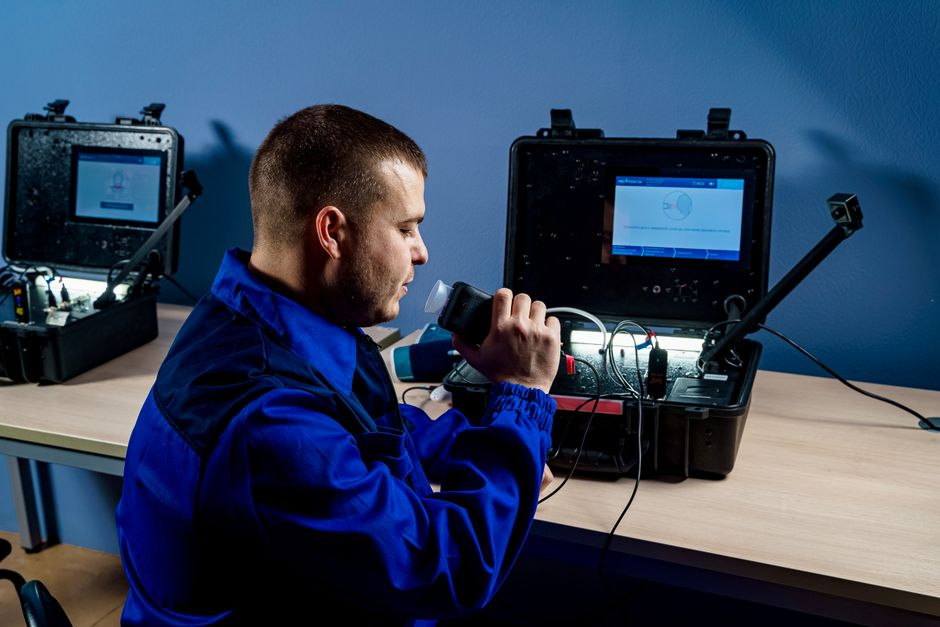 Technician taking an indoor air quality mold sample